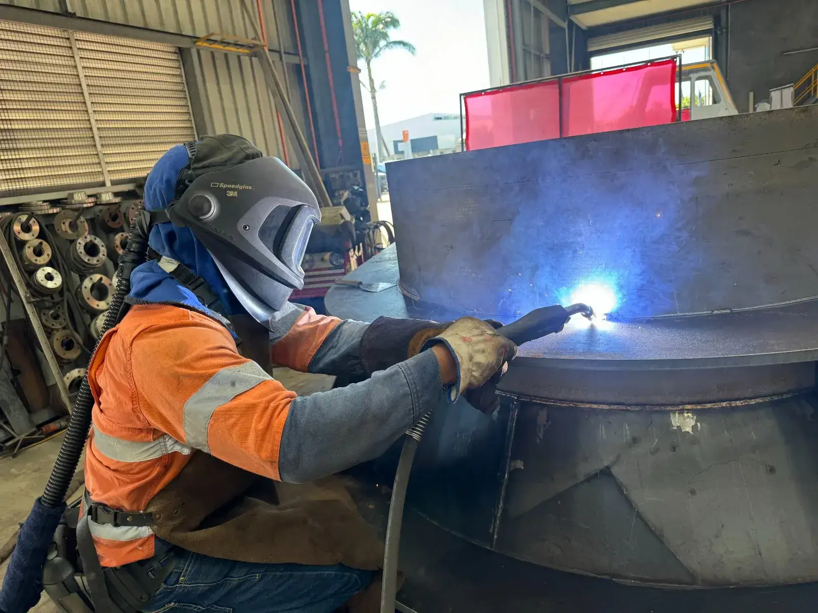 Welder fabricating structural steel